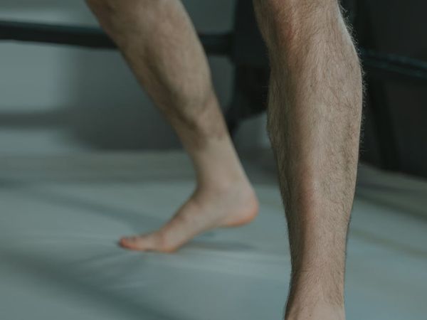 Man in a focused stance preparing for a strength movement.
